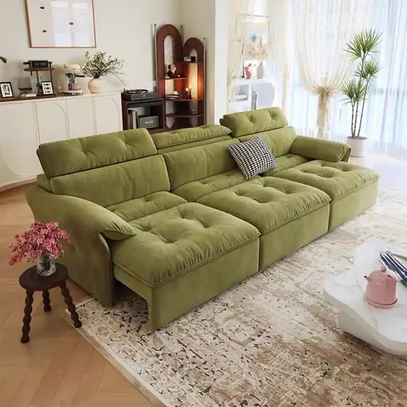green sofa bed couch with plush seating and relaxed lounge profile
