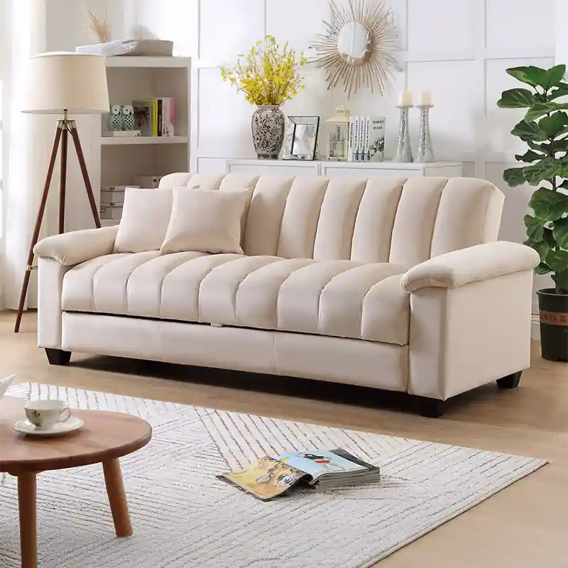  cream 3-seater sofa bed with channel-tufted design, wide padded arms, and modern living room styling