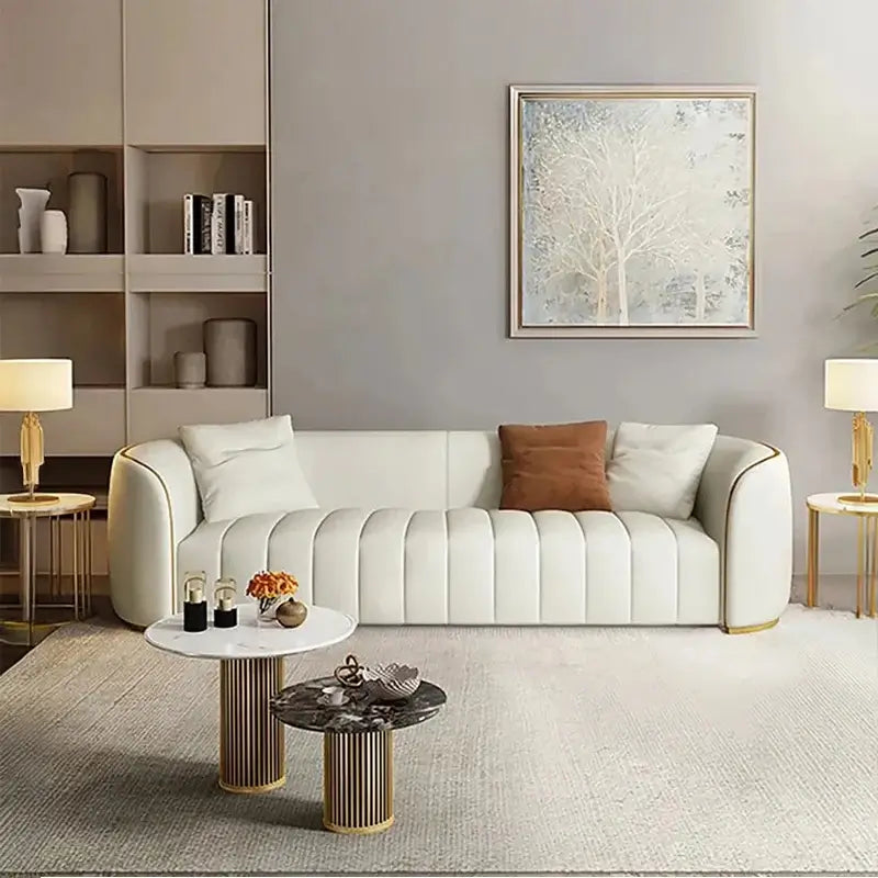 Luxury sofa set with channel-tufted backrest, curved sofa design, plush seating, and refined modern look