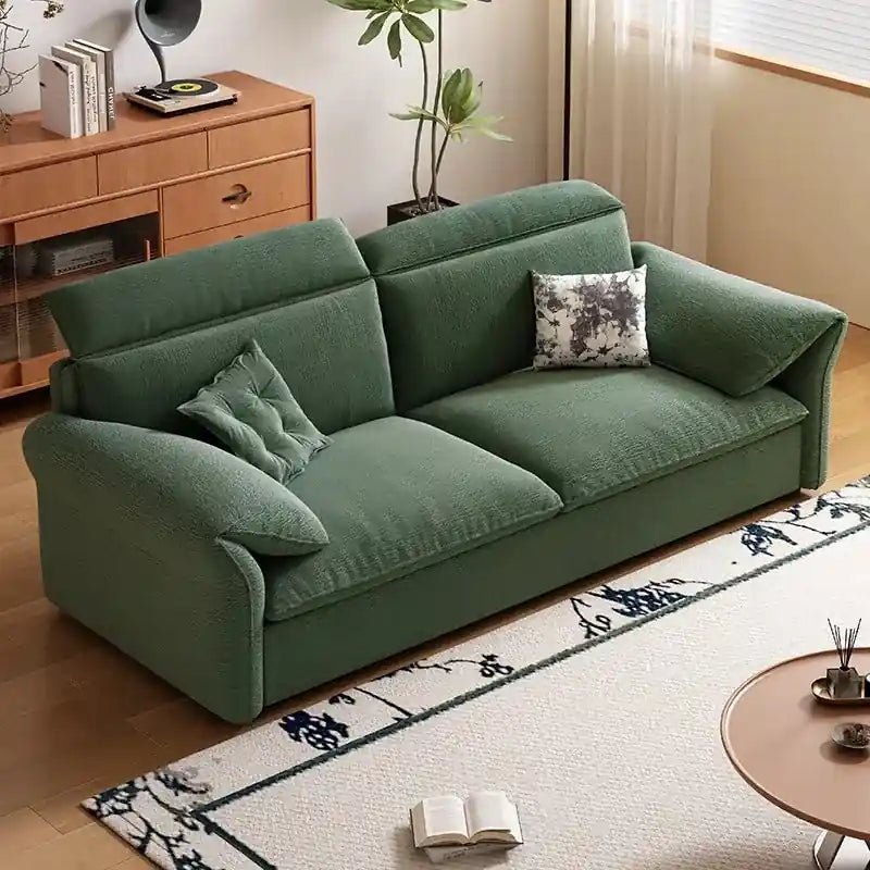  green sofa cam bed with textured fabric upholstery, segmented high-back cushions, and compact living room design