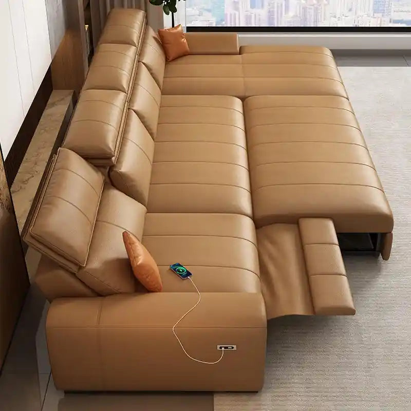 Close-up of brown sofa bed showing USB charging port and fold-out footrest detail
