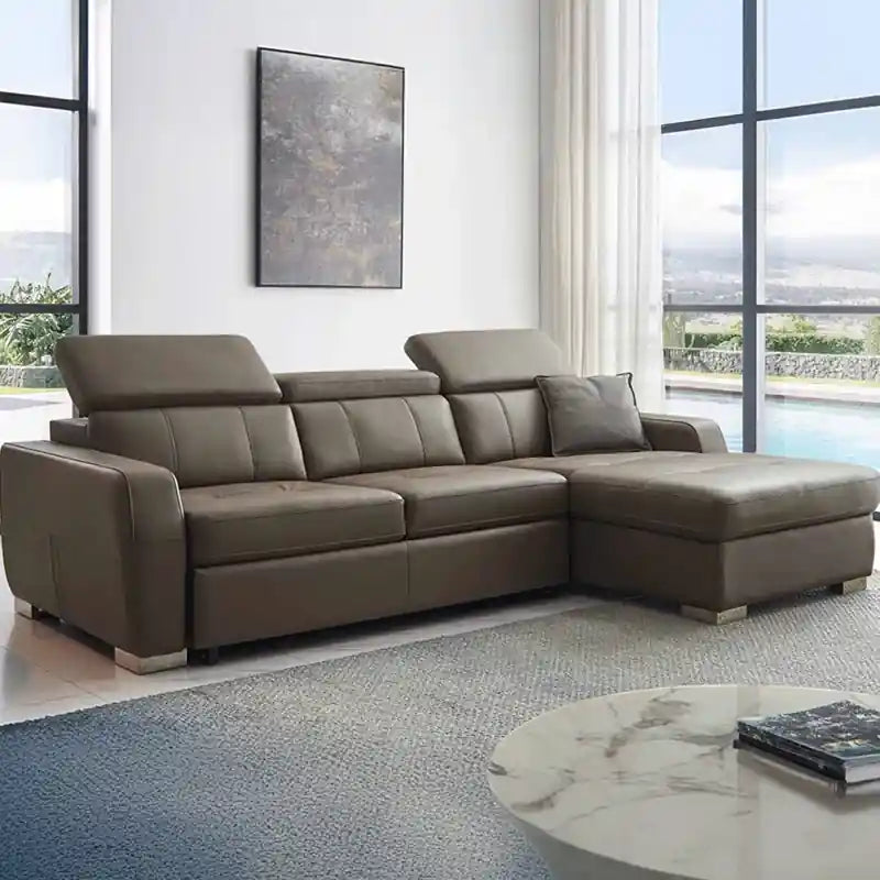  grey L shape sofa bed shown in living room view with chaise lounge, wide track arms, and medium-firm cushions