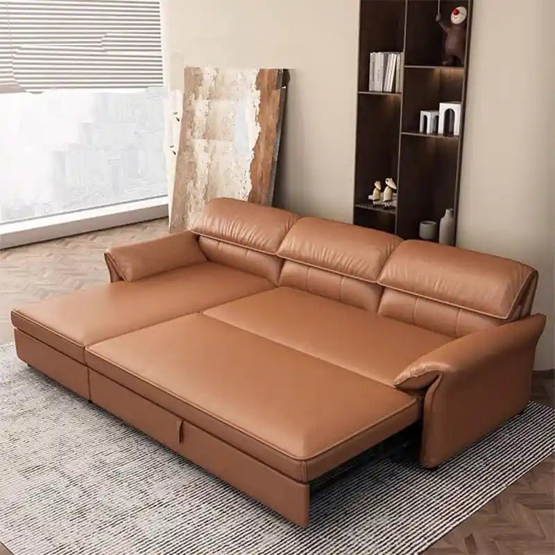  tan brown sofa bed converted into a flat sleeping surface with chaise layout, wide padded arms, and couch bed comfort