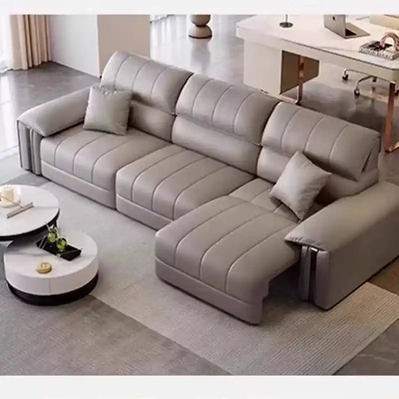 3 seater pull-out sofa bed with light grey leatherette upholstery, metallic armrest accents, and modern sofa bed comfort for guest use