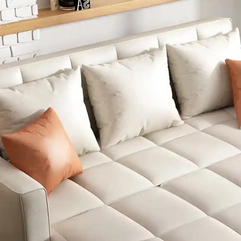 Couch bed with manual pull-out mechanism, loose back pillows, broad arms, and compact sofa cumm bed styling for modern homes