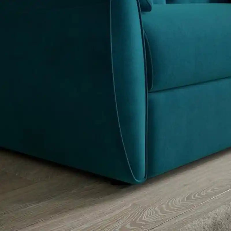  teal blue couch bed converted with pull-out sleeper mechanism, visible metal support frame, and quilted mattress surface