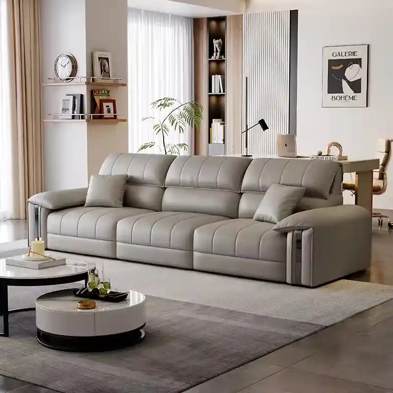 Modern sofa bed with 3 seater layout, pull-out sleeper function, light grey leatherette finish, channel stitching, and cushioned armrests