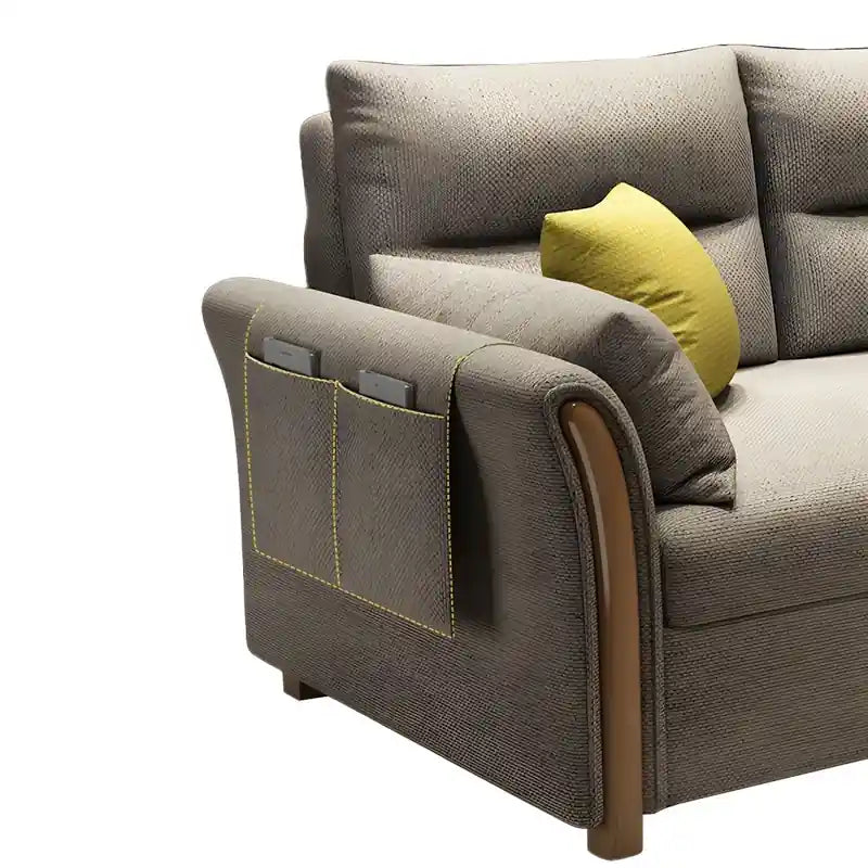 Close-up of grey sofa bed showing curved wooden arm panel, side pocket detail, padded armrest, and modern sofa cam bed finish
