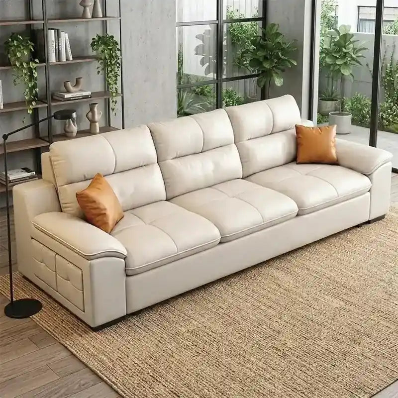 couch bed with cup holders in beige leatherette lounge view