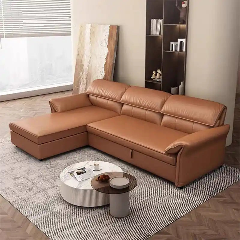 tan brown sofa cum bed with chaise lounge, pull-out bed function, cushioned backrest, and compact living room layout