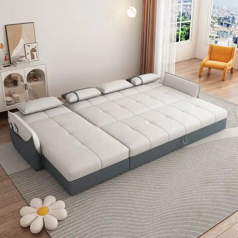 pull-out sofa bed converted into a flat sleeping surface for guest use
