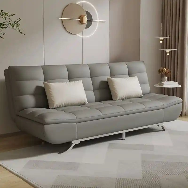  beige 3 seater click-clack sofa bed with soft pillows, tufted cushions, and metal angled legs