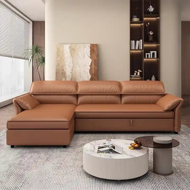  tan brown L shape sofa bed with chaise lounge, matching ottoman, raised pillow headrests, and modern living room styling
