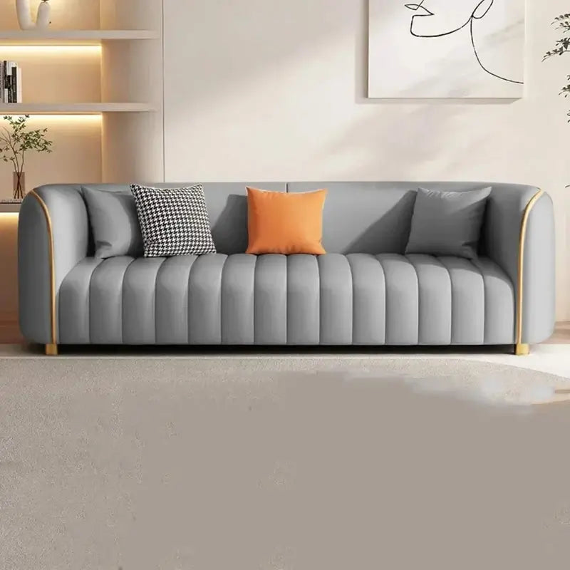Premium couch and settee with gold piping, ivory fabric finish, curved shape, and comfortable lounge seating