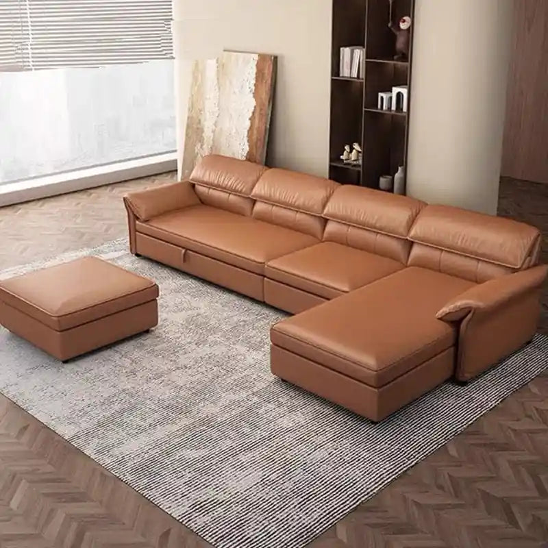 Close-up of  sofa bed with raised pillow headrests, tan brown upholstery, stitched back panels, and padded arm detail