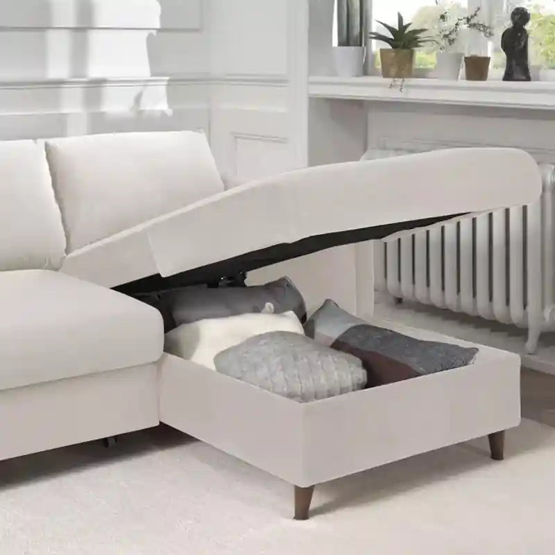  white sofa cumm bed close-up showing padded armrest, soft fabric finish, and wooden leg