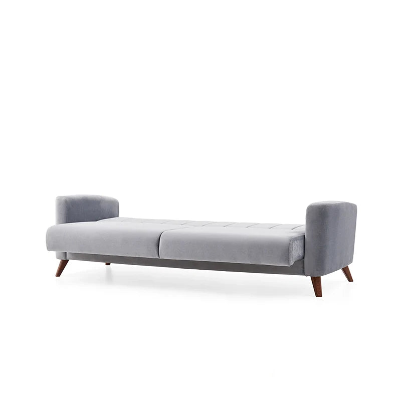 The vertical channel tufting and fixed medium-firm cushions offer both ergonomic support and understated elegance