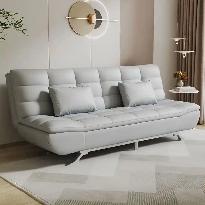  orange click-clack sofa bed with tufted leatherette upholstery, modern low-height frame, and sleeper use