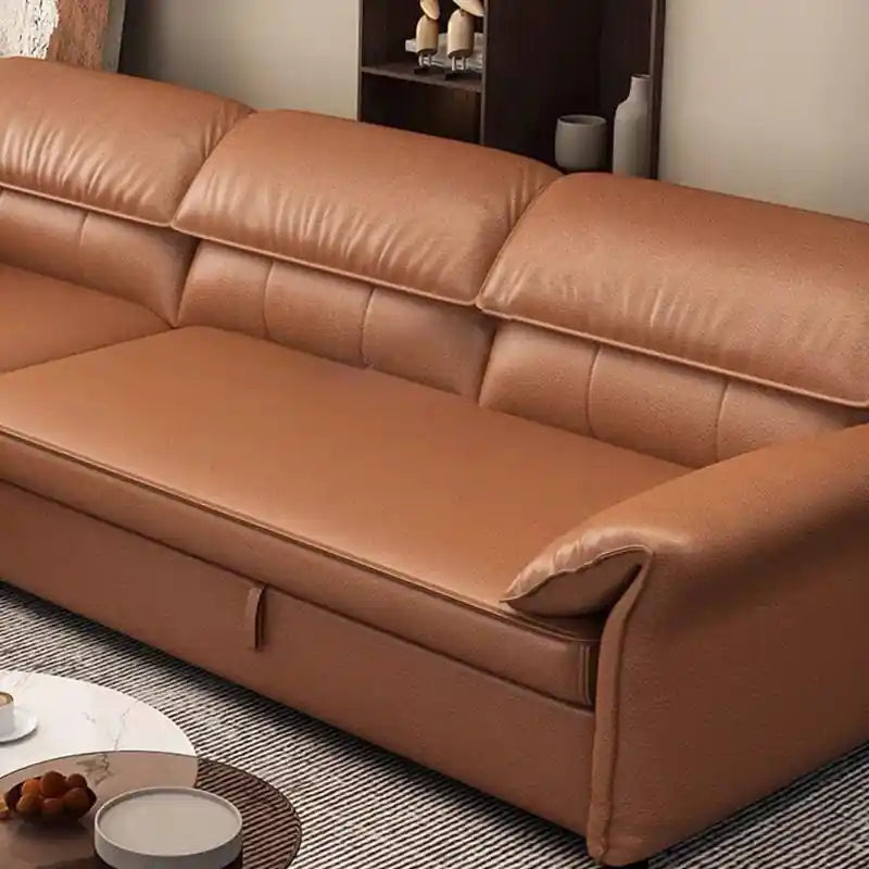  tan brown sofa bed converted into a flat sleeping surface with chaise layout, wide padded arms, and couch bed comfort