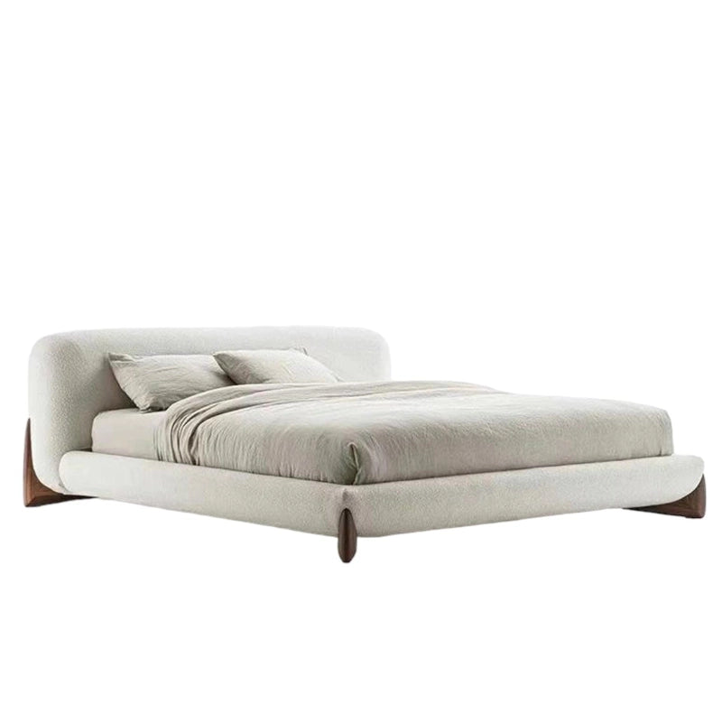 Designed with a soft curved silhouette, this premium bed frame features plush boucle upholstery