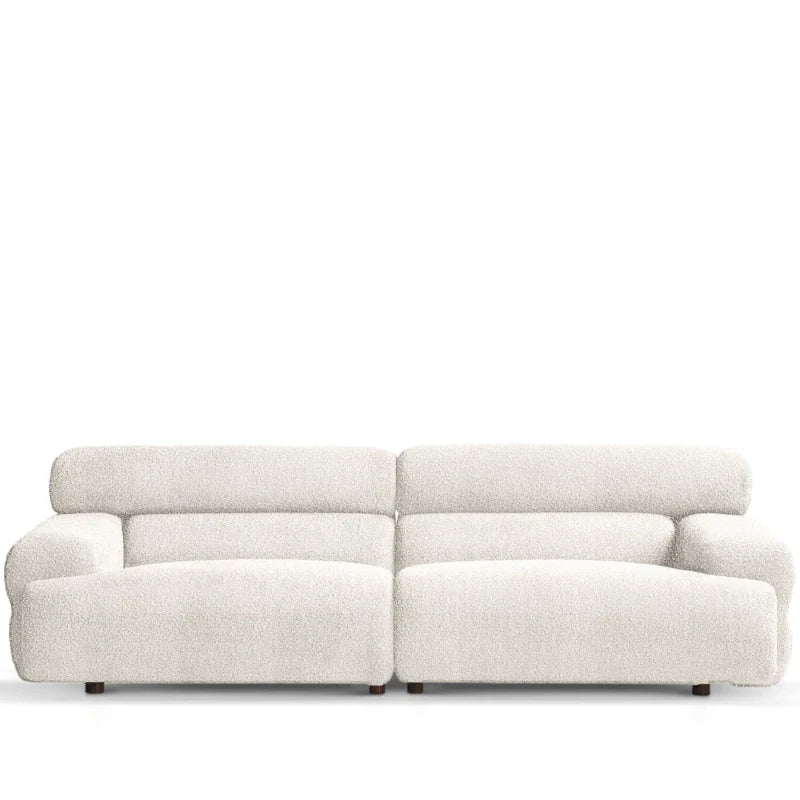 Upholstered in a plush boucle fabric, it brings both tactile warmth and stylish form to modern interiors.