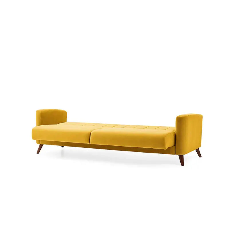 Yellow sofa with two patterned pillows on a white background