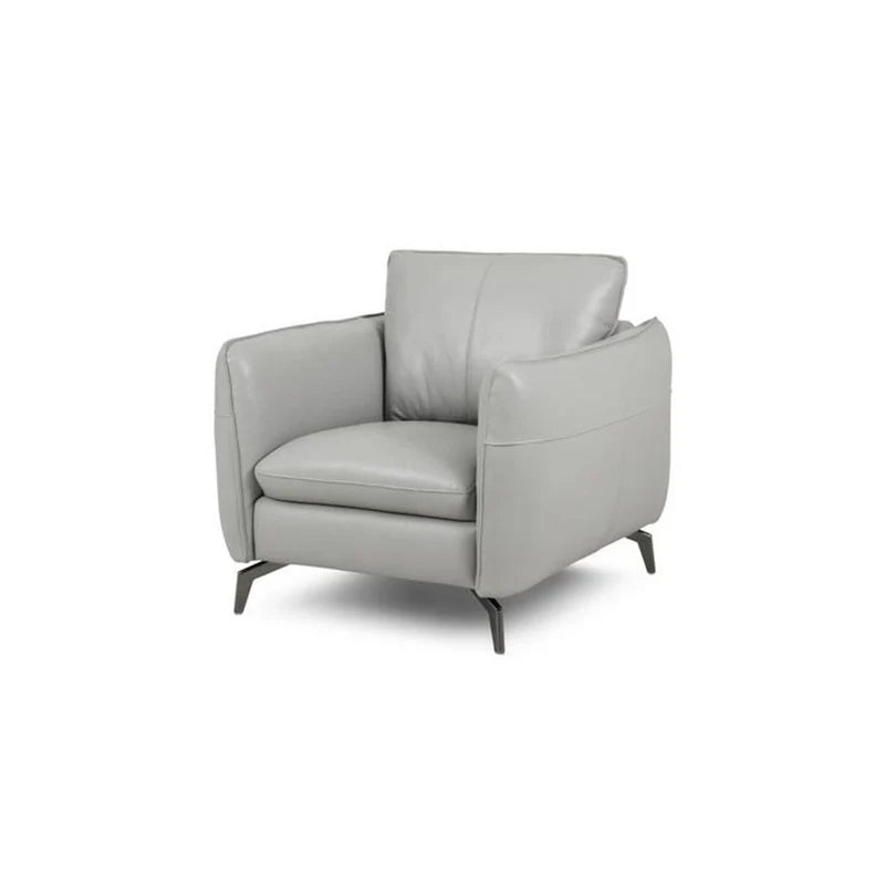 Upholstered in light grey pure leather, it features rounded armrests, high ground clearance, and neatly piped edges for a polished finish. 