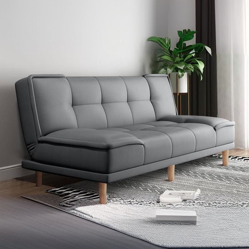 Tufted grey convertible sofa bed with wooden legs and compact 3-seater fabric finish