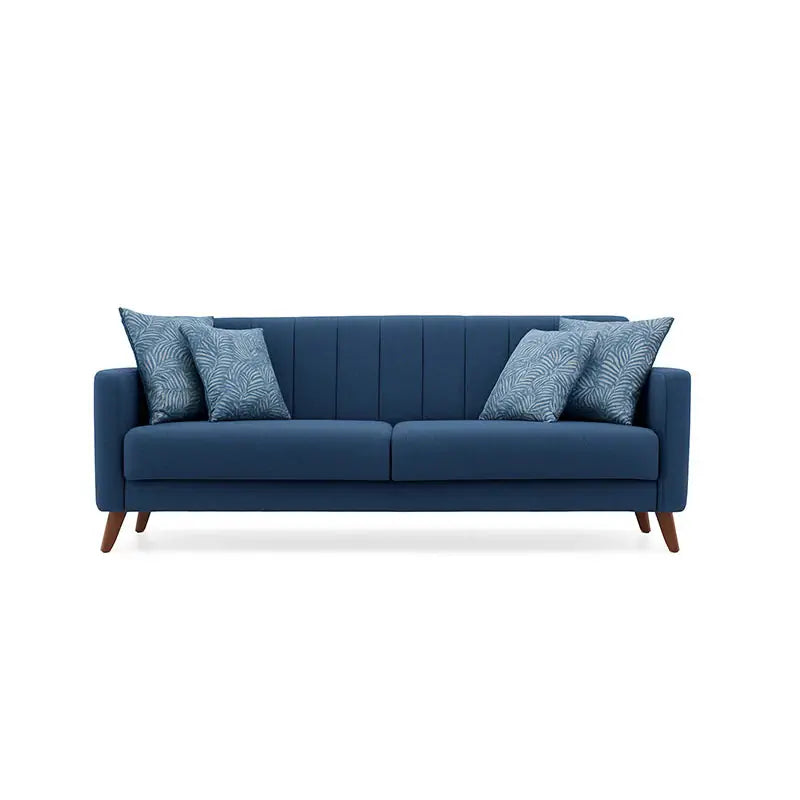 Blue armchair with a patterned pillow on a white background