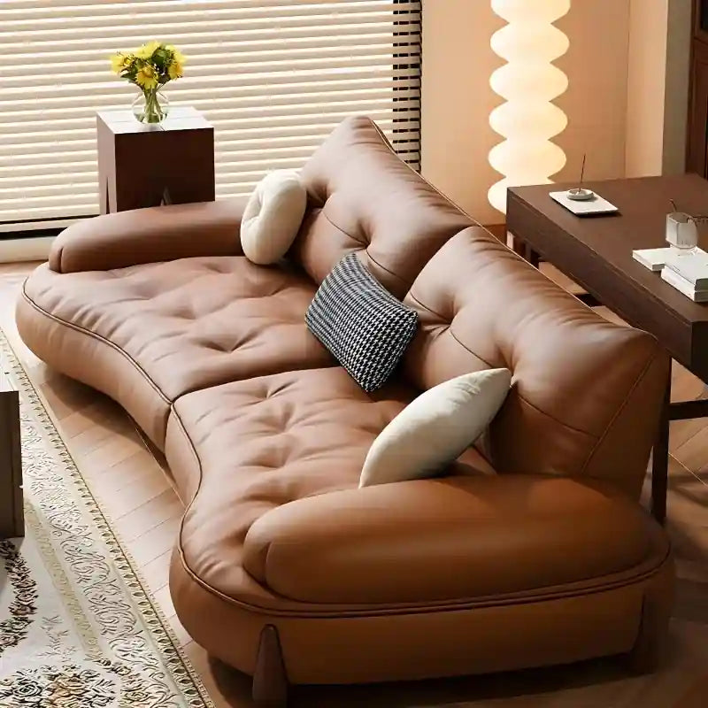 Curved arm lounge seating in caramel tone, modern sofa design, contemporary sofa design, leather