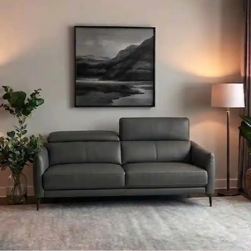 adjustable headrests and clean stitching, this piece complements luxury décor while functioning as a versatile living room