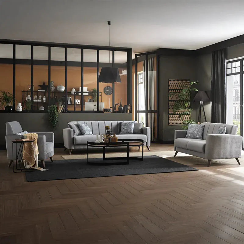 Gray sofa with decorative pillows in a living room setting