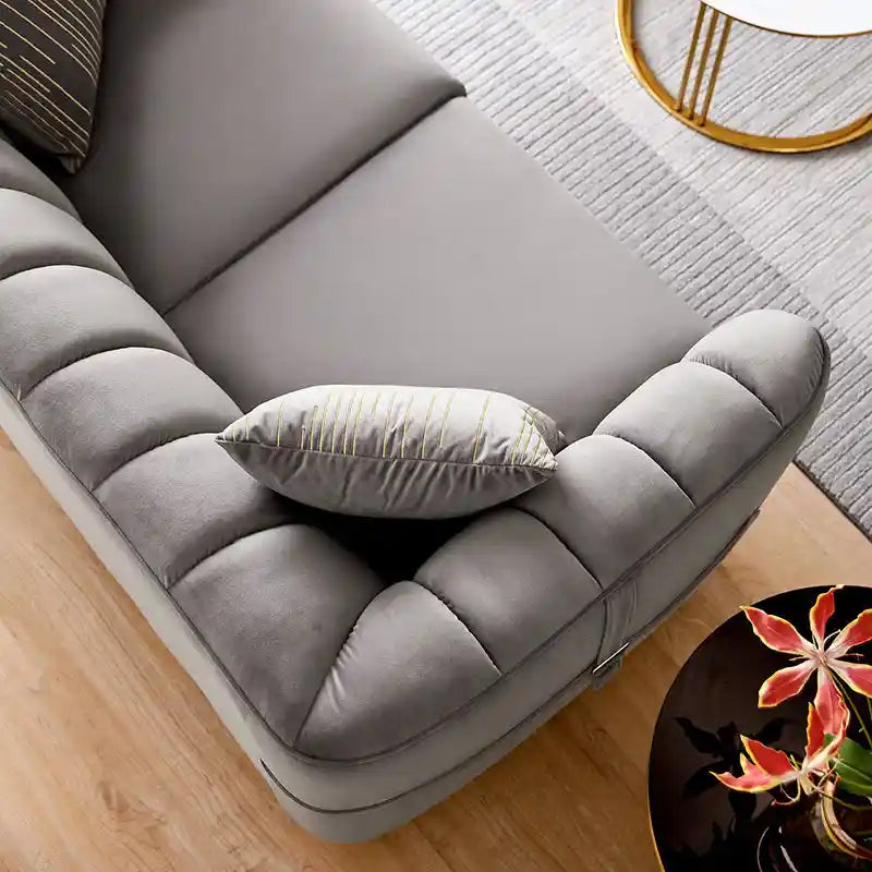 Designed as a 2 seater sofa, it features a velvet sofa finish with vertical tufting