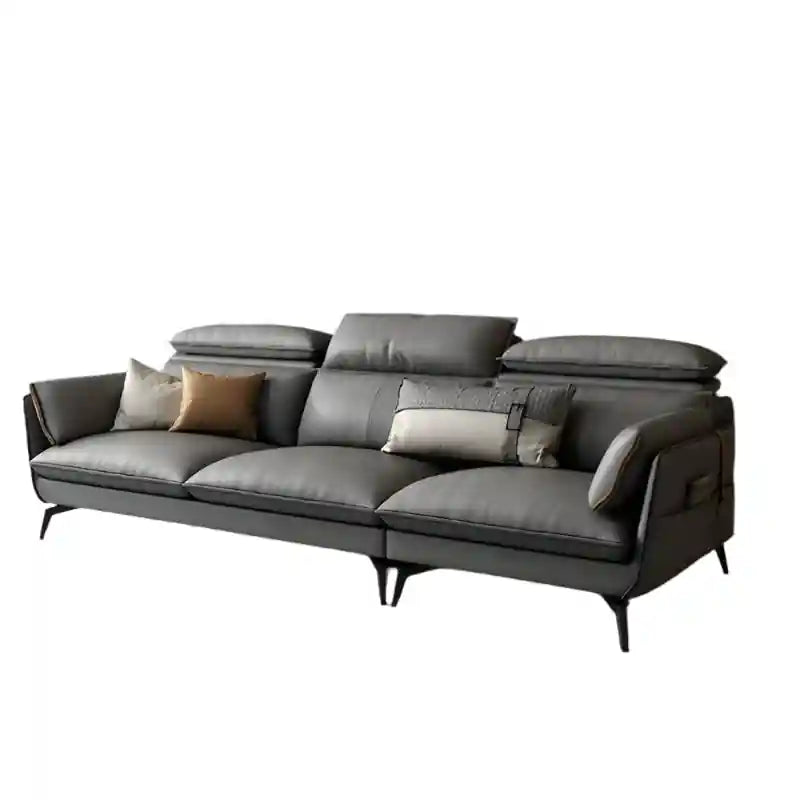 The soft, adjustable headrests and deep, structured cushions create a balanced seating experience, while integrated side pockets and tapered legs enhance both style and practicality. 