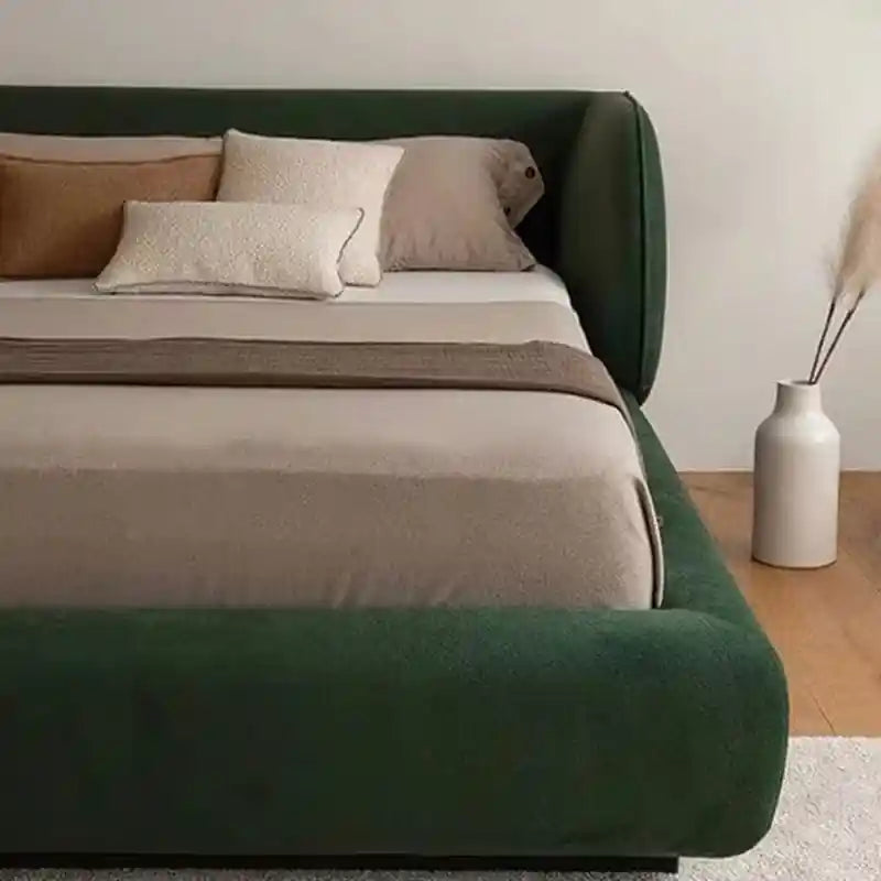 This sculpted upholstered bed merges form and function in a seamless modern bed design.
