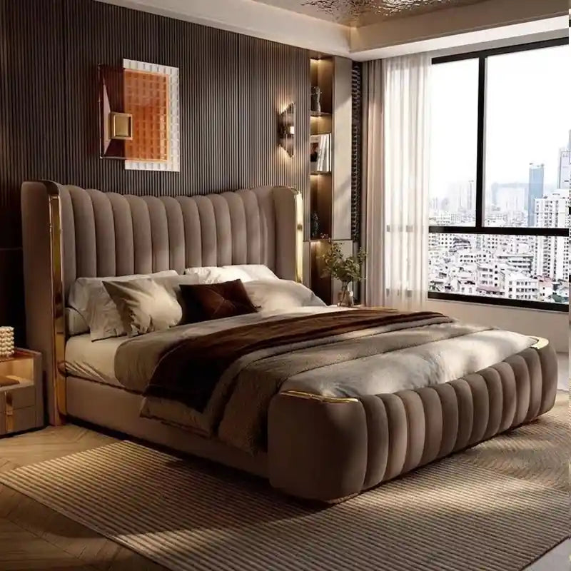 This modern bed design combines plush channel tufting, curved edges, and elegant metallic accents