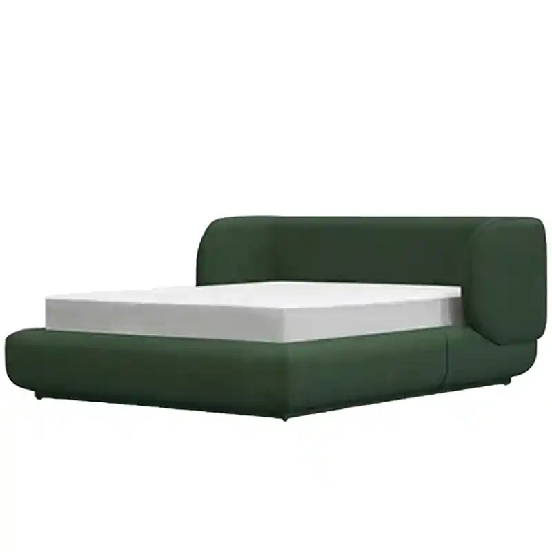 It features a thick wrap-around headboard and a fully padded frame, offering cocoon-like comfort in either a deep forest green or soft beige matte fabric.