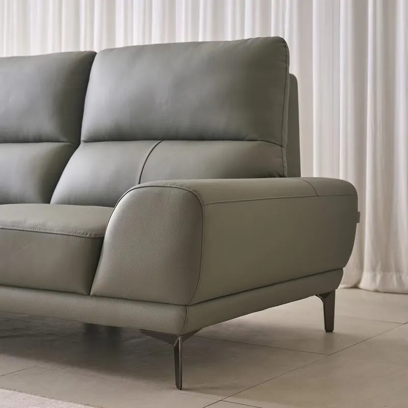 Designed as a 4 seater sofa, this couch fits seamlessly into urban homes with its straight layout and elevated metal legs