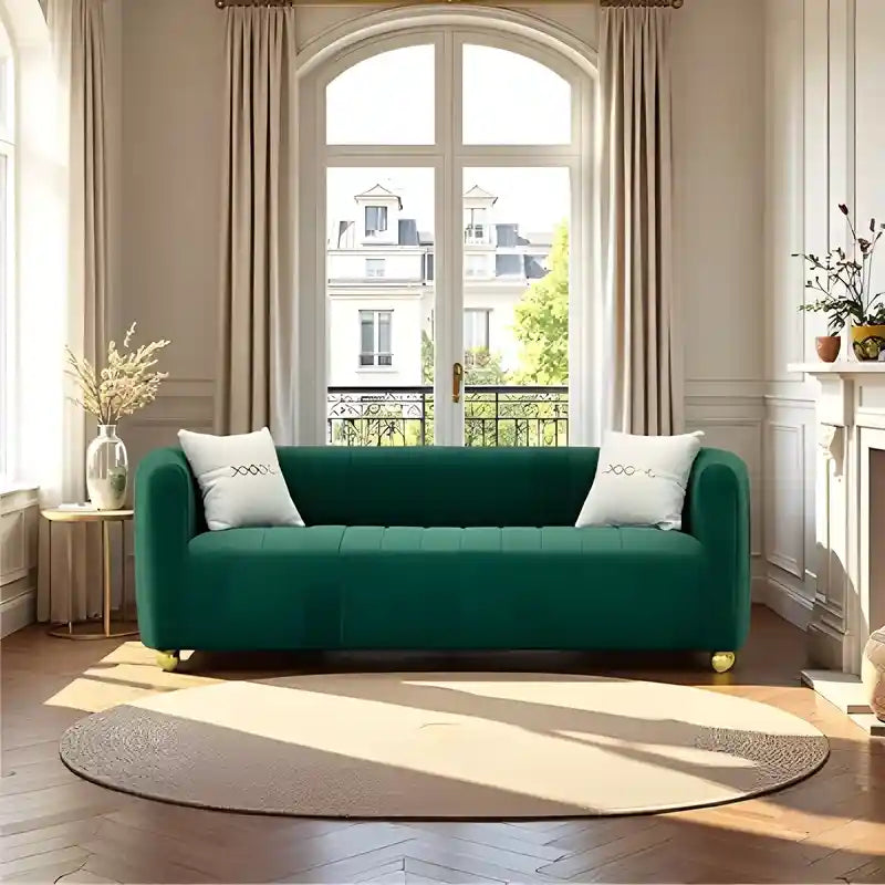 Available in elegant blush pink, emerald green, and black finishes, this designer sofa enhances modern décor themes effortlessly