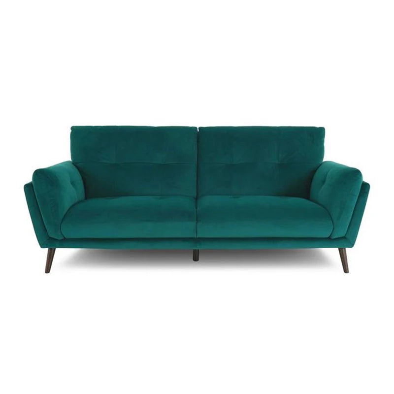 The deep tufted cushions and angular armrests provide both support and structure.