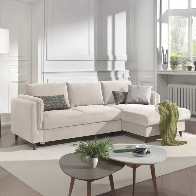 This L-shaped couch converts smoothly into a practical sleeping surface, making it useful as both everyday seating and a guest bed.